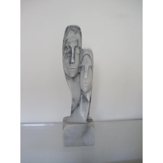 A substantial Post-Modern or modern style marble head/bust carved figurative sculpture piece of two people embraced side-...