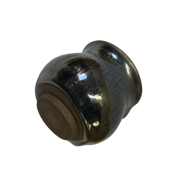 This is a nicely handmade teacup in metallic black and silver marks finish. In Jianyang, Jiankou tea set with a small...