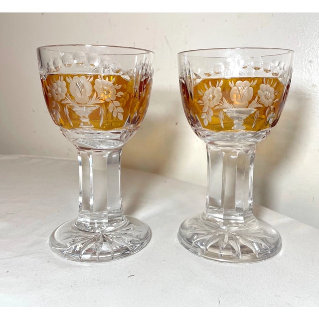 Up for sale is a very high quality pair of hand cut to clear crystal goblets. They feature a vibrant orange color cut to...