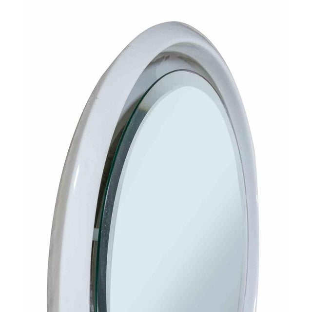 Vintage Wall Mirror is an original design item realized in the end of 1970s. Ceramic mirror backlit. Collect a design item!