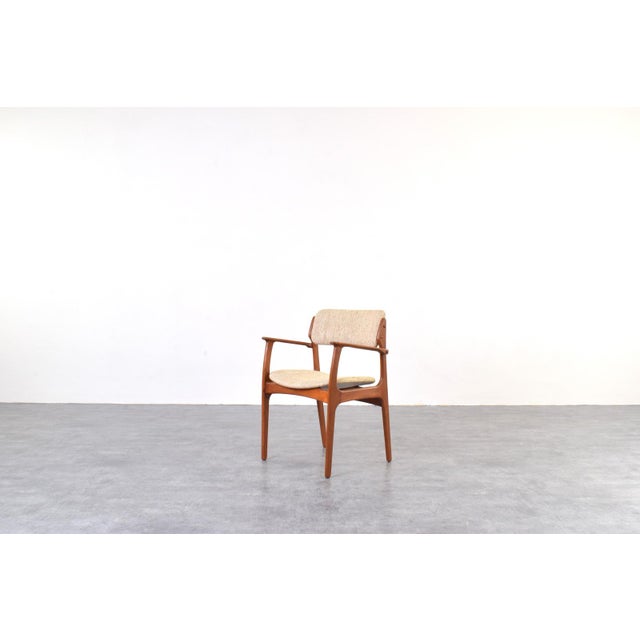 This teak chair model 49 was designed in the 1960s by Danish designer Erik Buch and manufactured in Denmark by O.D....
