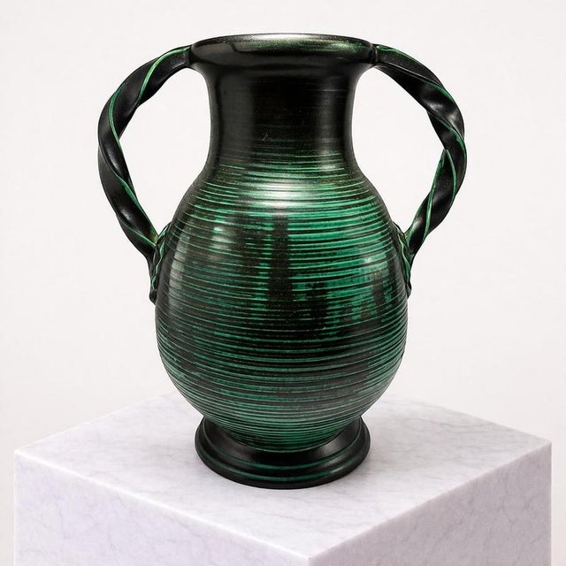 Striking Swedish Art Deco vase produced by Uppsala Ekeby in the 1930s, showcasing the bold sculptural sensibility and...