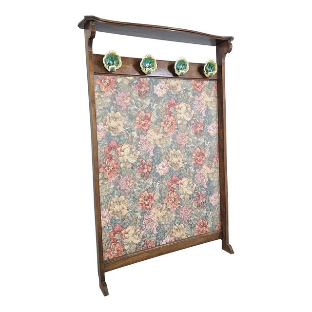 Coat stand in wood and damask fabric embellished with painted porcelain handles. Dimensions (wxdxh) 123 x 19 x 183 cm