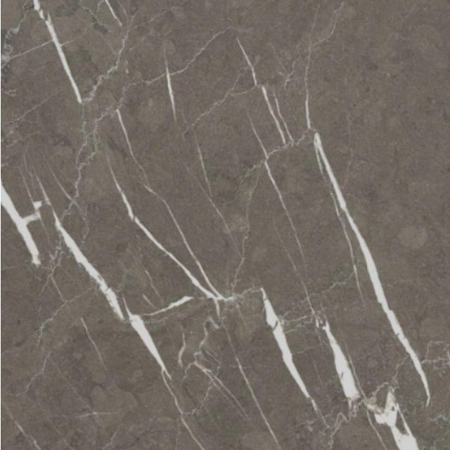 Sculptural table in Pietra Grey marble (100x100x30 cm). The glossy surface enhances the depth of the pure black, traversed...