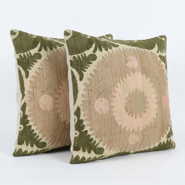 This beautiful 24'' x 24'' & 24'' x 25'' hand-embroidered Suzani pillow cover set was made from authentic Uzbek cotton...