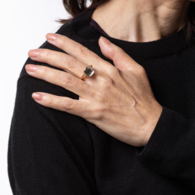 Finely detailed estate Pomellato white topaz Nudo ring, crafted in 18 karat yellow gold. Faceted white topaz measures...