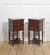 This sophisticated pair of early 20th-century mahogany bedside cabinets offers both decorative refinement and practical...