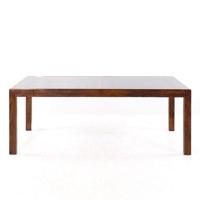 Henredon Mid Century Walnut and Mirrored Top Expanding Dining Table with 2 Leaves This table measures: 81 wide x 41 deep x...