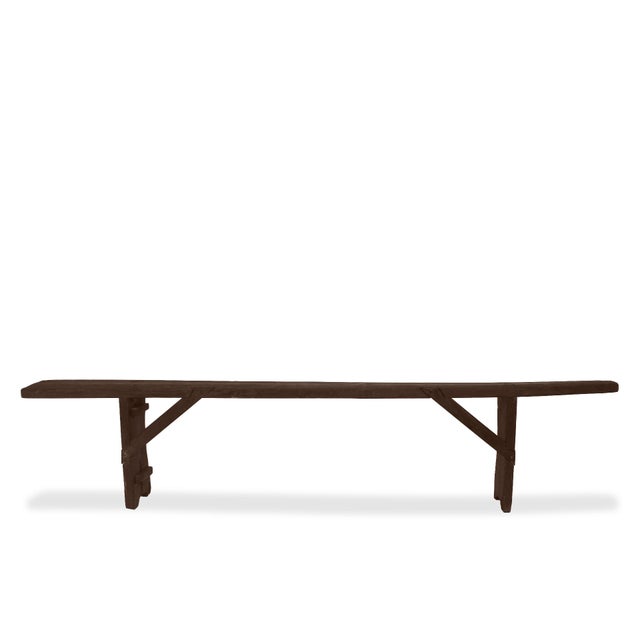 This 19th-century English country farm bench embodies rustic charm and enduring craftsmanship. Constructed from solid...