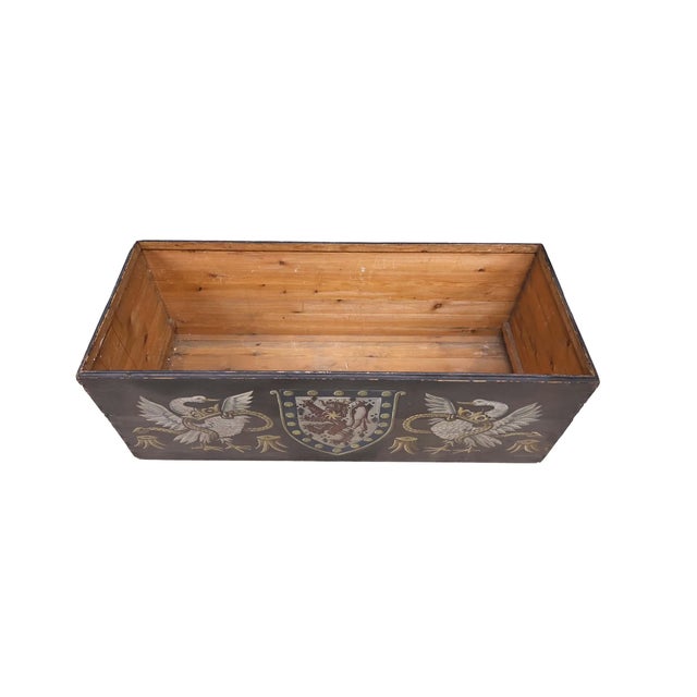 A striking late 19th-century Continental painted pine chest, dated 1897, with bold hand-painted heraldic and sporting...