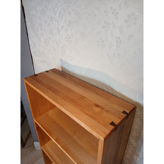 Beautifully handcrafted open-shelf bookcase executed somewhere between Mid-Century Modern and post-modern style. This...