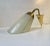 Early 1950s wall light made in Scandinavia in a style reminiscent of Stilnovo and the french modernist movement. Its...