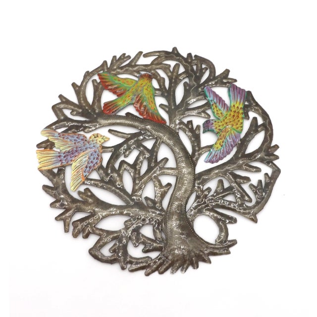 This piece of Haitian folk art was created from recycled oil drums and was cur and shaped by hand. This tradition started...