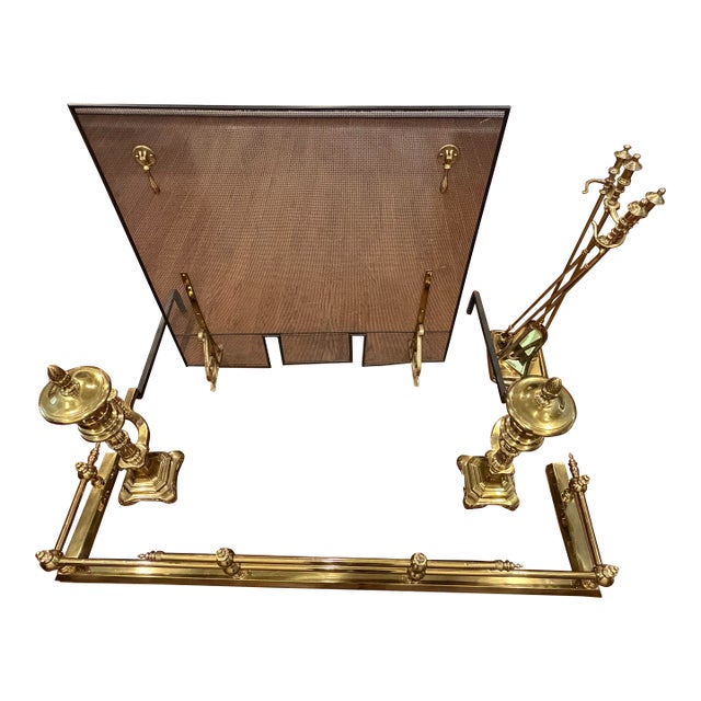 Turn of the century antique brass fireplace accessory set. Set includes: • a large, rectangular mesh panel with a black...