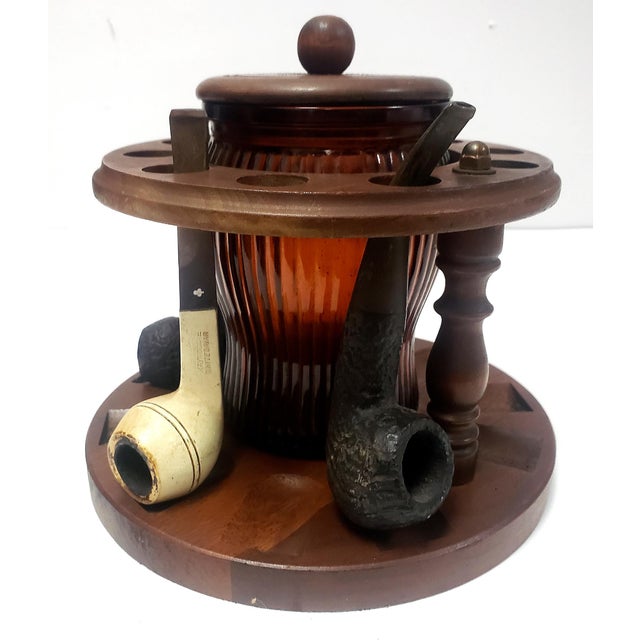 Offered for sale is a 1950s Walnut Dun-Rite Pipe holder Stand for 10 Pipes with a Duraglass amber glass Humidor Tobacco...