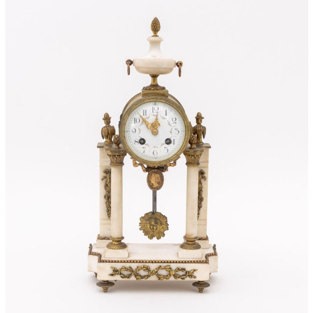 Louis XVI Style Marble and Gilt Bronze Three-Piece Clock Set, late 19th century, the portico clock with strike on bell...