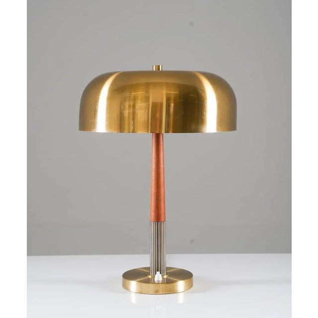 Table lamp model 8391 by Boréns, Sweden. This lamp is made of brass and with details in teak. Condition: Very good...