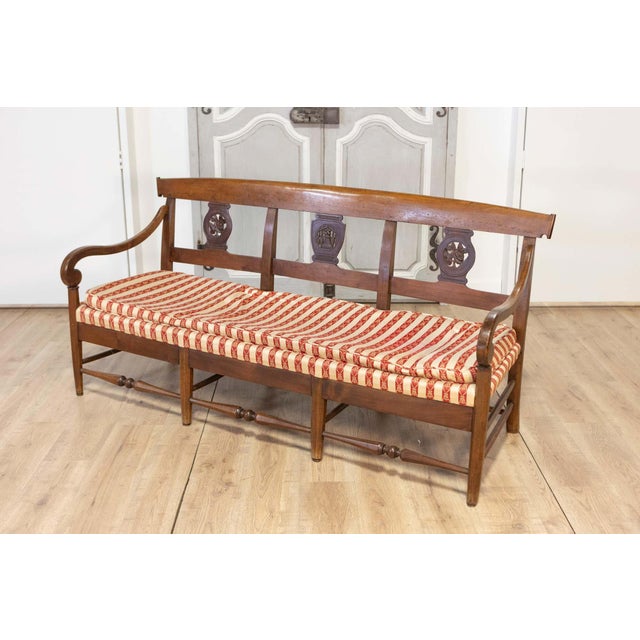 This elegant 19th-century French sofa bench, crafted around 1820, showcases the timeless sophistication of early 19th-...