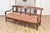 This elegant 19th-century French sofa bench, crafted around 1820, showcases the timeless sophistication of early 19th-...