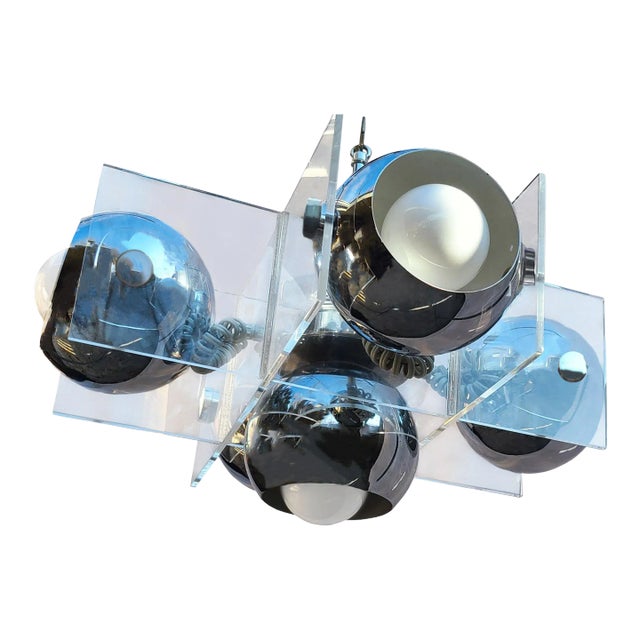 This chrome chandelier draws interest due to its Italian design and atomic vibes. There are five eyeballs, nestled in...