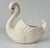 Graceful lines, unruffled feathers, glossy white surface.....oh yeah and it can hold a plant! This Vintage ceramic planter...