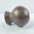 This handcrafted clay pot is a traditional vessel made by the Zulu people of South Africa. Known for their skill in...
