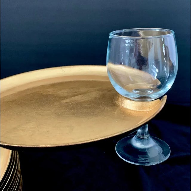 A vintage Mid Century Hollywood Regency set of 12 gold leaf lacquer melamine 9" diameter cocktail plates with glass cup...