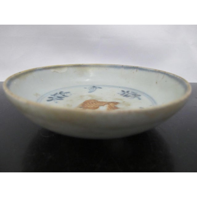 Chinese Hongzhi -Zhengde Ming Dynasty plate. Small saucer dish is decorated with a raised moulded goldfish colored in...