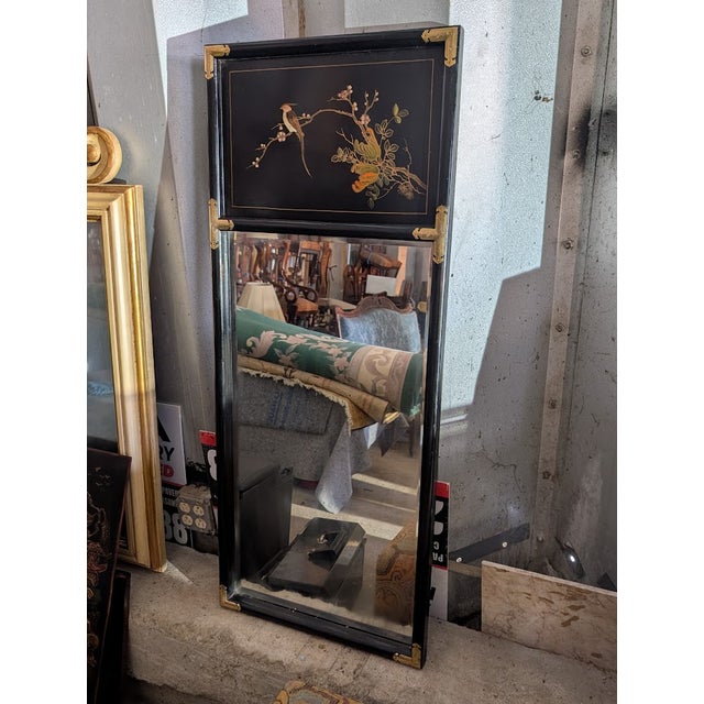 This elegant tall Chinoiserie mirror brings sophisticated Hollywood Regency flair with a sleek black lacquer frame...