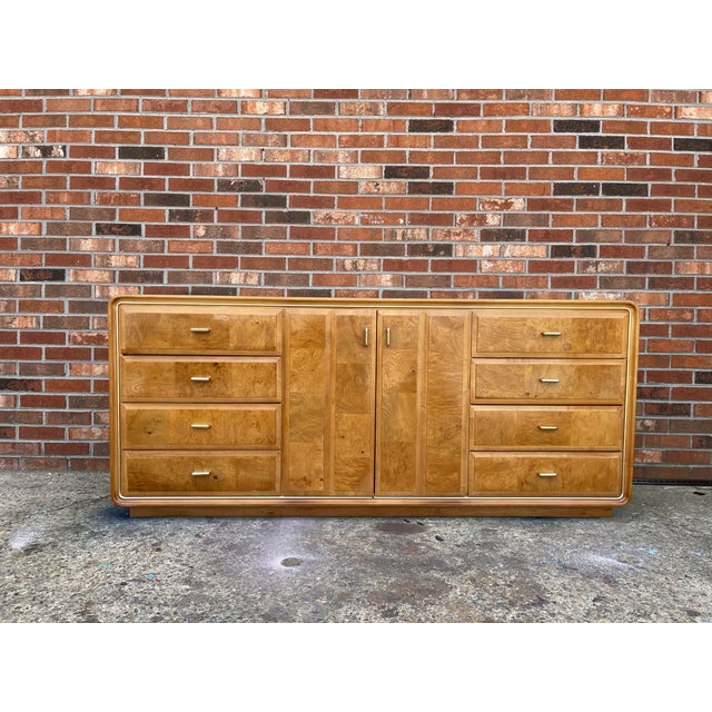 Unique and genuine American of Martinsville 11 drawer dresser features waterfall edges, gold trim, burlwood and honey gold...