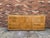Unique and genuine American of Martinsville 11 drawer dresser features waterfall edges, gold trim, burlwood and honey gold...