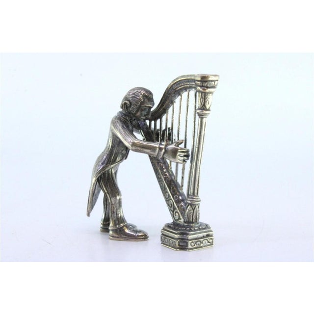 Silver Figure of Musician Playing the Harp, in Very Good conditions. Designed 1920 to 1949 This piece has an attribution...