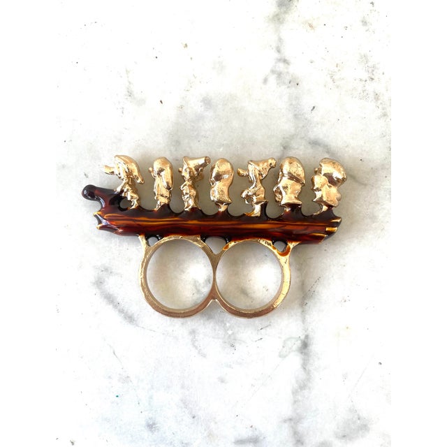 Paul McCarthy Walt Paul Store, WS Souvenirs, The whimsical 'Seven Dwarves' double ring features all seven dwarves walking...