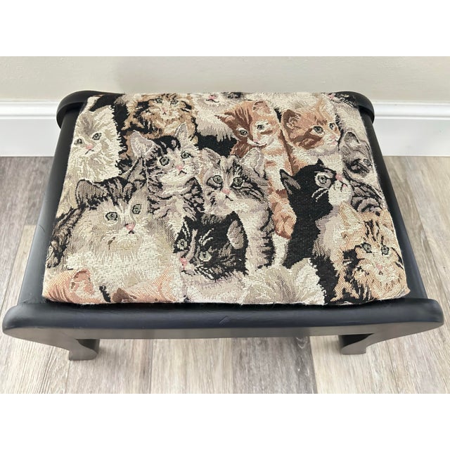 Vintage solid Cherry wood foot stool from the early 1900s. Made in the U.S.A. The cushion has been recovered in a cat...