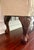 Chippendale-style carved mahogany settee/bench with ball-and-claw feet with elegant cream and champagne damask fabric and...