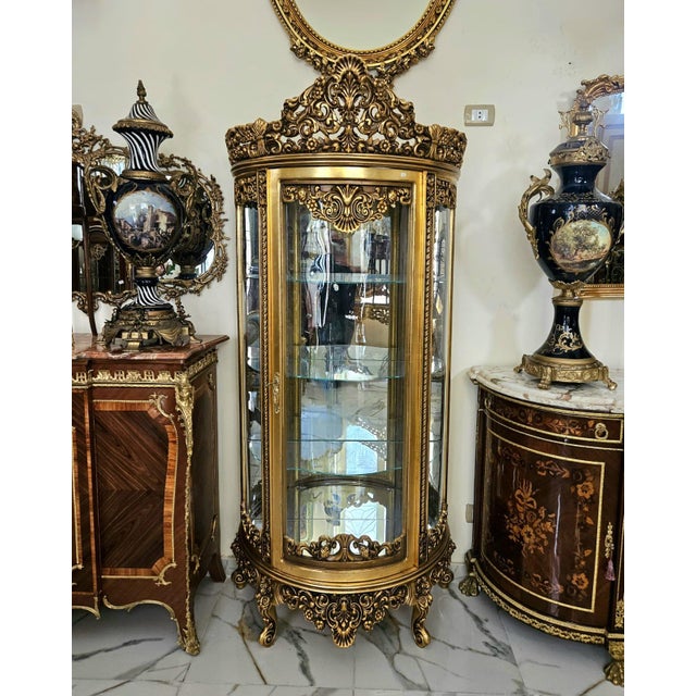 Make a statement with this exquisite French Rococo-style display cabinet, designed to showcase your most treasured pieces...
