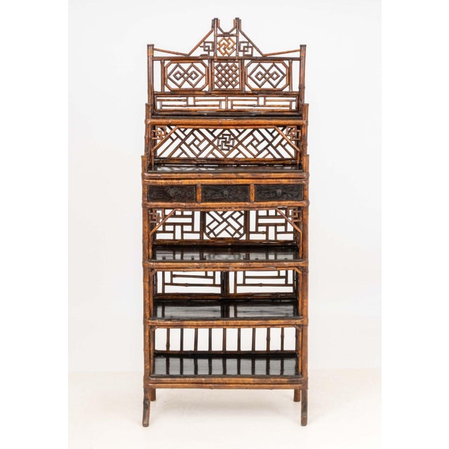 Aesthetic Movement Chinoiserie Bamboo and Elm Etagere, 19th century, with three drawers and shelves. 79.25" H x 31.75" W x...