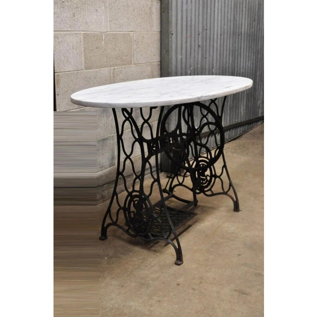 Antique Cast Iron Singer Treadle Sewing Machine Base Oval Marble Top Console Table. Item features a thick oval white...