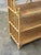 A gorgeous room divider or étagère composed of bamboo, rattan, and cane shelves. Features 5 shelves. Would work along with...