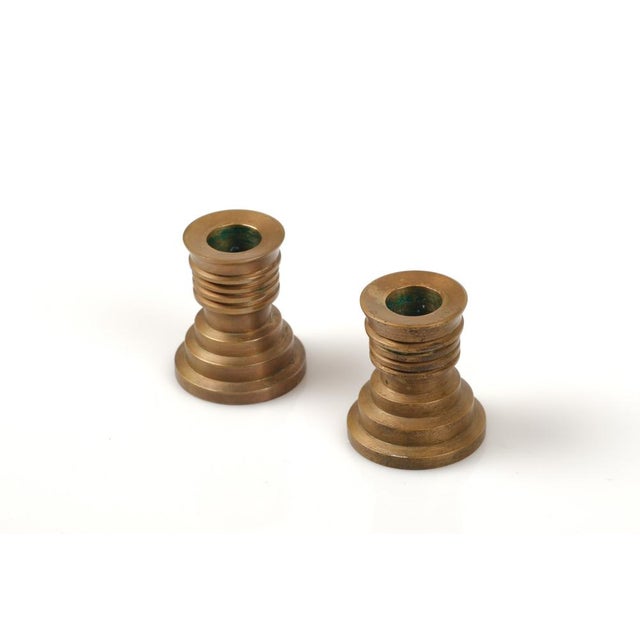 Modern Art Deco pair of candlestick holders made of bronze, designed with several levels. C 1930s.