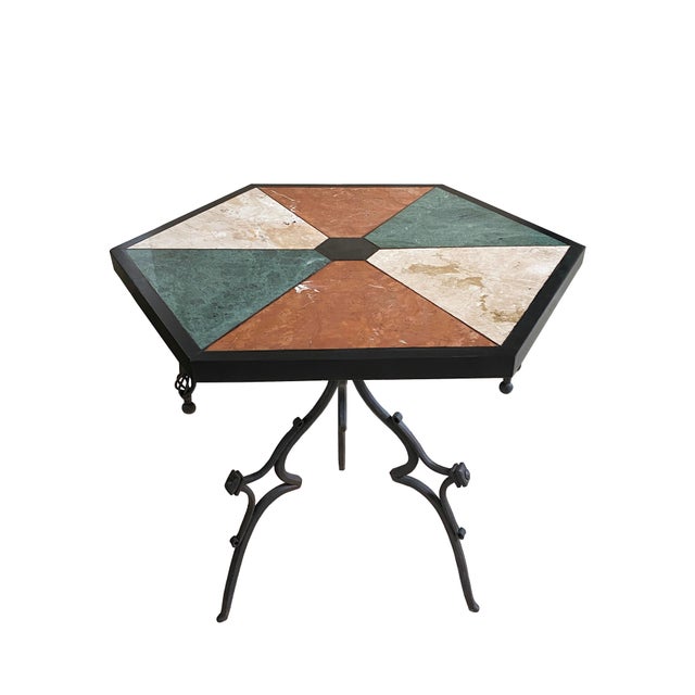 Mid-Century English gothic style table. The base is a work of art, a trio of hand-forged wrought iron legs with gothic...