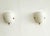 Minimalistic pair of french wall lights, made of milky white glasses. The glasses are held in place by a minimalist brass...