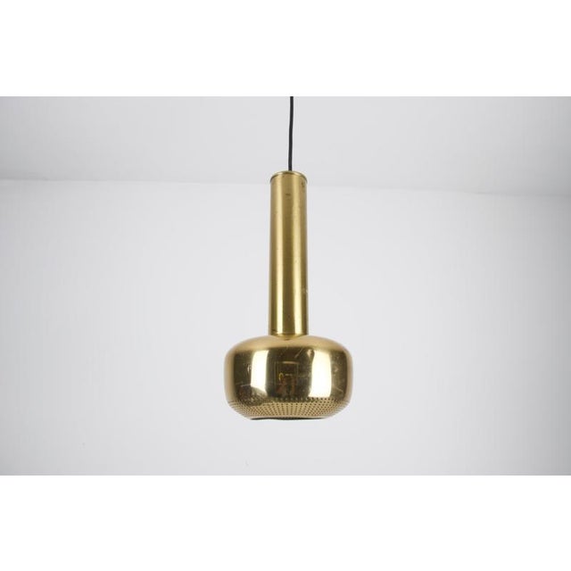 This refined pendant lamp is an exemplary piece of mid-century danish lighting design, attributed to the celebrated...