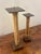 Sculptural pair of vintage candlesticks combining bundled natural bamboo, wrapped cane and heavy dark-finished steel bases...