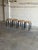 Beautiful set of four vintage Danish stools featuring minimalist Scandinavian modern design with round wooden seats and...