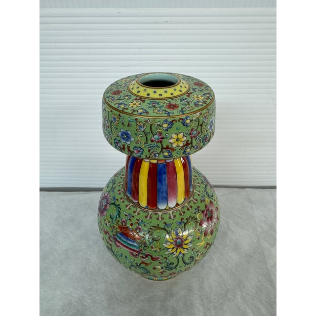 Design Plus Gallery presents a Qianlong Famille Rose Vase from China. The vase is hand painted with ornamentations that...