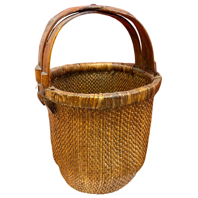 Vintage Chinese handwoven bamboo harvest or gathering basket dated January 1983, featuring a tightly woven rounded body,...