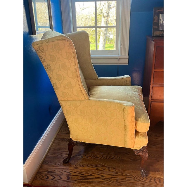 A gorgeous, silk damask flared wing chair with elegant proportions. Upholstered in yellow silk damask in excellent...