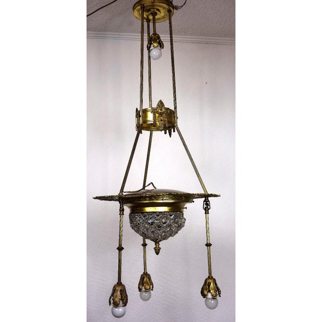 Antique Art Nouveau French Brass and Crystal Chandelier, 1890s, in Very Good conditions. Designed 1890 to 1919 I have...