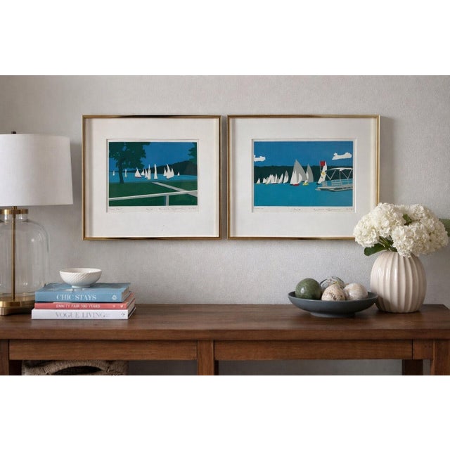 A coordinated pair of signed and numbered limited-edition serigraphs dated 1987, depicting modern nautical lake scenes...